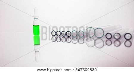 Group Of Vials With Medication On Blue Methacrylate Table. Horizontal Composition.