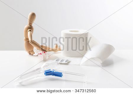 Composition With Anoscope On White Background. Hemorrhoid Treatment
