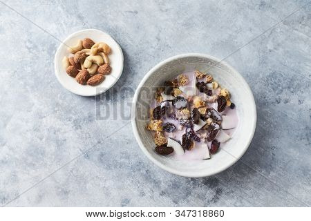 Bowl Of Granola With Yogurt, Nuts, Cranberry And Cocoanut. Concept For A Tasty And Healthy Meal. Sto
