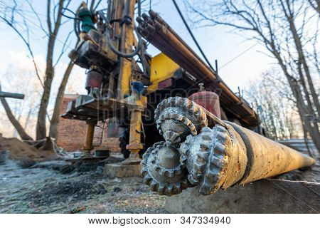 Auger From Hydraulic Ground Water Hole Drilling Machine Installed On The Old Truck With Big Wheels O