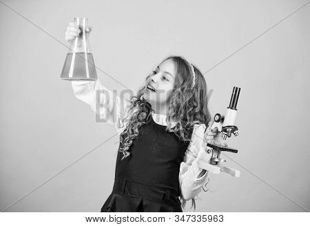 Child Study Bilogy Lesson. Discover Future. Small Girl Scientist With Testing Flask. Education And K
