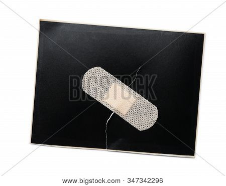 Black Paper Sheet With Sticking Plaster Isolated On White, Top View