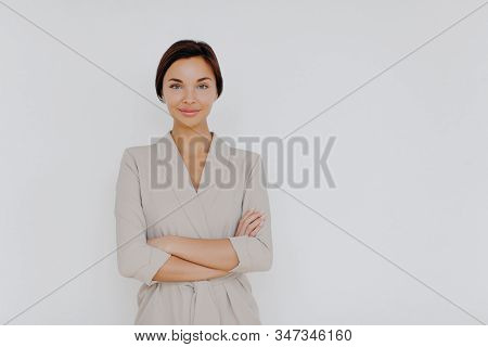 Attractive Businesswoman Wears Beige Formal Clothes, Makeup, Kees Hands Crossed Over Own Body, Owns 