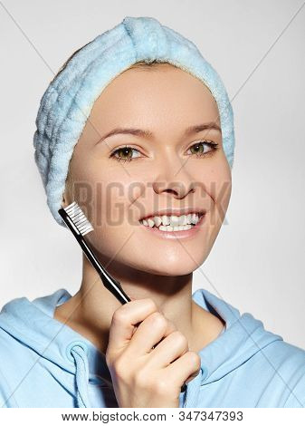 Beautiful Woman In Headband With Great Teeth Holding Tooth Brush. Daily Routine Teethcare Treatment