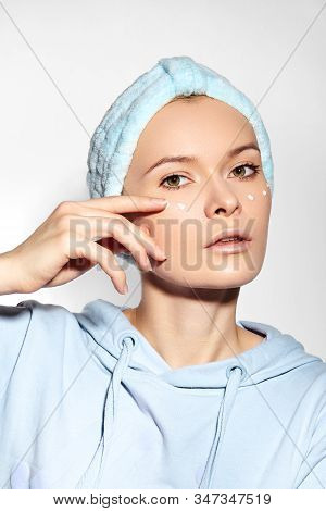 Woman Applying Beauty Skin Cream. Wrinkle Cream Or Anti-aging Skin Care Moisturizer. Daily Morning F