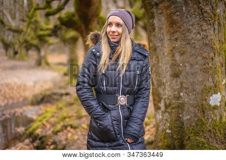 A Young Smiling Blonde Walking In The Otzarreta Forest In The Natural Park Of Gorbea, Bizkaia. Basqu