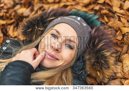 Lifestyle Session, A Young Woman Lying In The Leaves Of The Otzarreta Forest In The Natural Park Of 