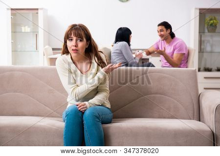 Young family and mother-in-law in family issues concept