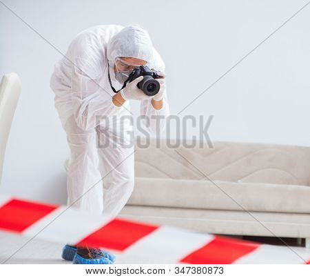 Forensic expert at crime scene doing investigation