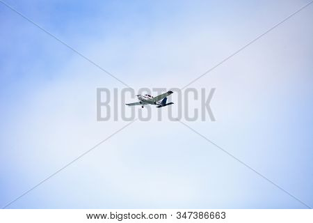 Small Cessna 172 Airplane Soars Through Blue Sky Over The Southwestern Part Of Florida.