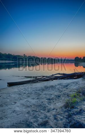 Tranquil And Peaceful Picturesque Landscape Of The Pripyat River With Wooden Boat At Foreground. Lak