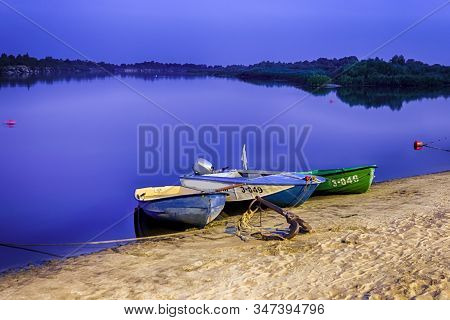 Motorboats Moored At Sandy Shore Of The Peaceful Pripyat River. River Is A Part Of National Rivers R