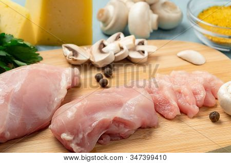 Slicing Chicken Breast Fillet For Cooking With Champignons And Cheese