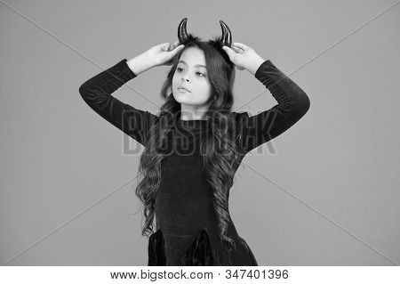 Beautiful Small Imp. Girl Red Horns Celebrate Halloween. Carnival Concept. Trick Or Treat. Halloween