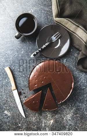 Chocolate brownies cake and coffee cup on old kitchen table.