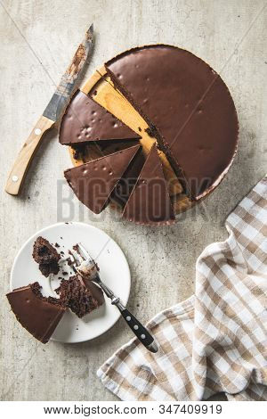 Chocolate brownies cake on old kitchen table.