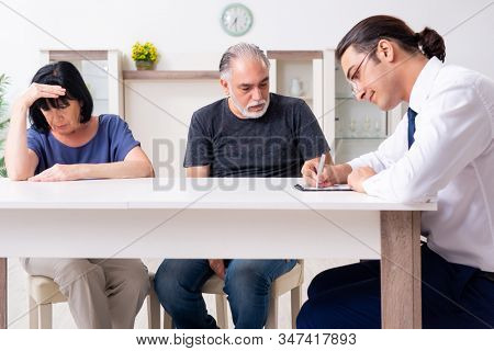 Financial advisor giving retirement advice to old couple