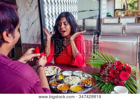 Amased And Surprised Indian Woman Feeling Happy To Get Proposal From Her Boyfriend In Restaurant. I 