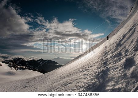 Distance View At Trekker Going Up The Mountain