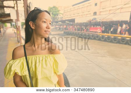 Young Beautiful Tourist Woman Exploring The City