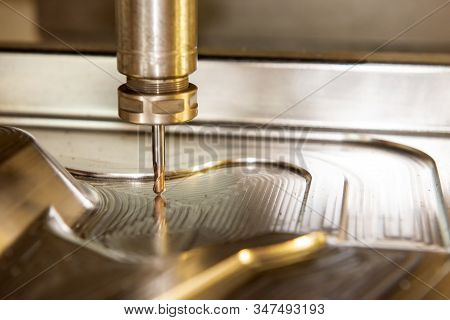 The Cnc Milling Machine Finishing Cut The Forging Mold Parts By Solid Ball  Endmill Tools. The Mold 