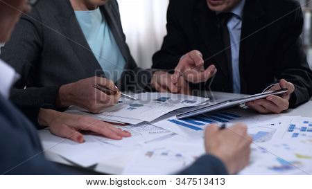 Campaign Office Workers Looking At Exit Poll Results, Elections Development Plan