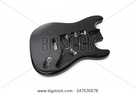 Black electric guitar body isolated on white. Three pickup routing. 
