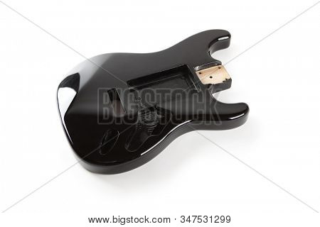 Black electric guitar body isolated on white. Universal pickup routing.