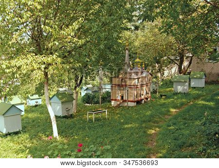 Beehives In The Apiary Of The Monastery In Holy Trinity Koretsky Monastery. The Hive Temple Is The A