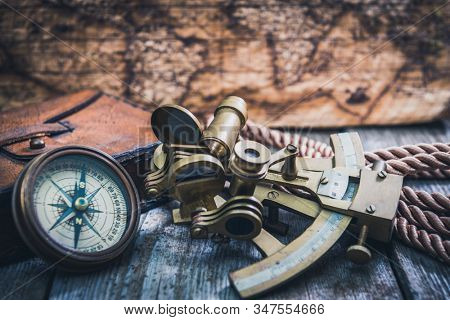 vintage still life with compass,sextant and spyglass