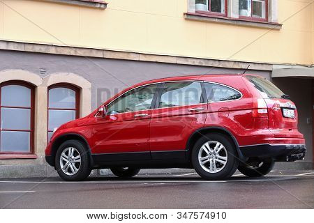 Linkoping, Sweden - August 25, 2018: Red Honda Cr-v Suv Parked In Linkoping, Sweden. There Are 4.8 M