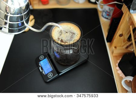 Black Porous Ceramic Paperless Coffee Filter On Glass Jug. Gooseneck Kettle. Electronic Scale. Manua