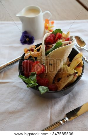 Shaverma Fruit Roll With Vegetables And Fruit And Sauce
