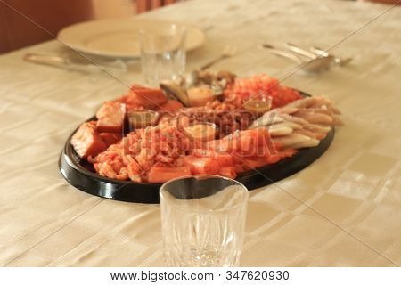 Serving Plate With Fresh Luxurious Seafood And Sauce
