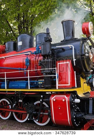 Old Soviet Steam Locomotive Blowing Off The Steam Out Of The Whistle.