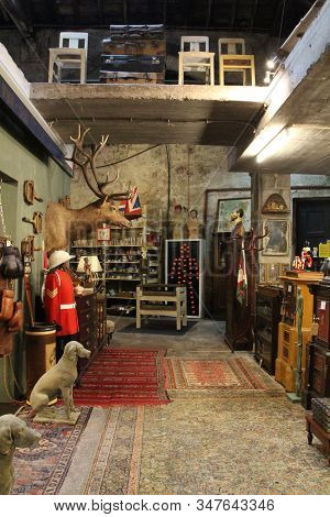 Porto, Portugal- January 3, 2020: Old Warehouse Called Armazem With Various Antiques For Sale In Por