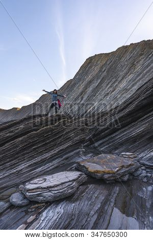 Deba, Gipuzkoa / Spain »; January 26, 2020: A Young Woman In The Geopark Of The Sakoneta Coast One W