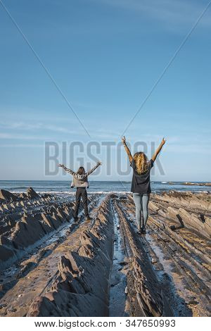Deba, Gipuzkoa / Spain »; January 26, 2020: Two Young People Enjoying Sakoneta