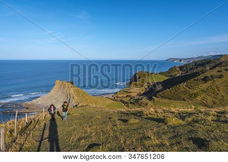 Deba, Gipuzkoa / Spain »; January 26, 2020: Two Young People Visiting The Coastal Area Of Sakoneta