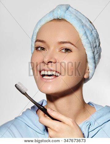 Beautiful Woman In Headband With Great Teeth Holding Tooth Brush. Daily Routine Teethcare Treatment