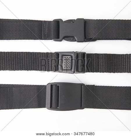 Black Plastic Fastex Clip For Backpacks On A White Background. Items Of Clothing And Equipment