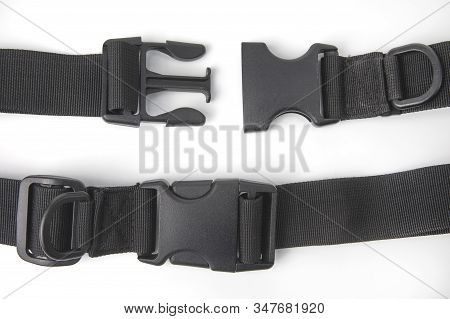Black Plastic Fastex Clip For Backpacks On A White Background. Items Of Clothing And Equipment