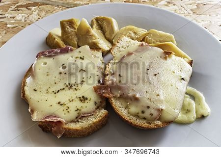 Bruschetta With Cheese, Ham, Origan, Olive Oil. Artichoke Salad.