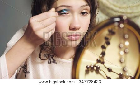 Female Child Clumsily Using Sisters Eyeshadow, Wants To Look Like Adult, Closeup