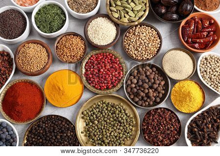 Aromatic Spices And Herbs In Metal And Ceramic Bowls. Top View.