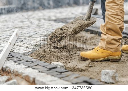 Building Granite Brick Path Around A House. Home Garden Improvement.