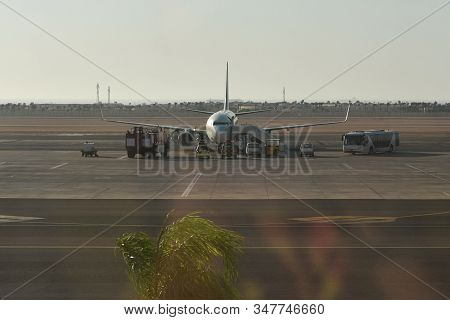 Pre-flight Passenger Airplane Service At An African Airport.