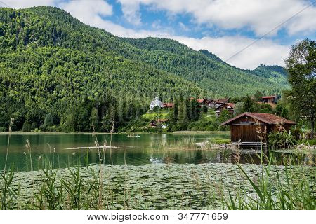 Weissensee Lake In The Bavarian Alps Near Fuessen, Allgaeu, Bavaria, Germany