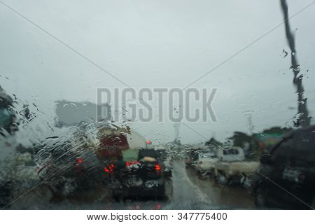 The Inside Of The Car Windshield During Heavy Rain Is Not Clearly Visible.