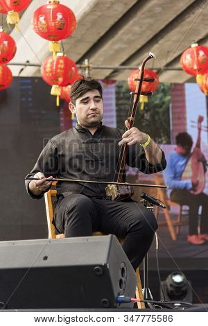 Capital Federal, Buenos Aires / Argentina; Jan 25, 2020: Young Musician Performing An Erhu, A Tradit